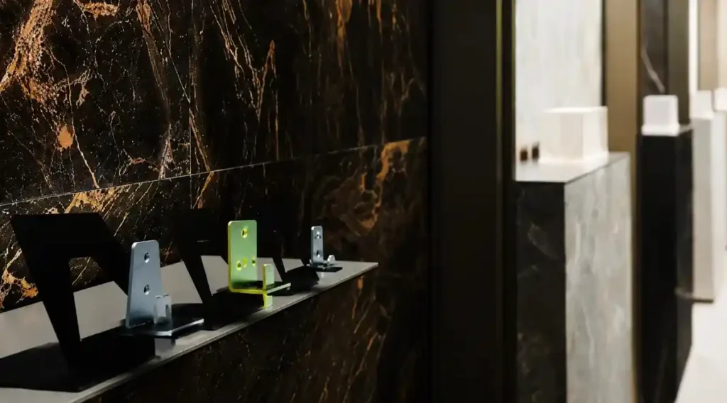 Premium mounting accessories displayed on dark marble.